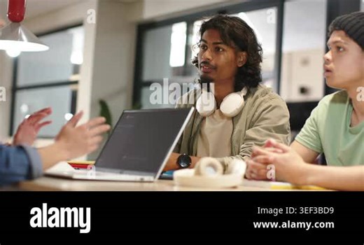 Diverse peers seeing left speaker gesturing, man shifting, clarifying point, raising palm by laptop. Collaboration, teamwork, discussion, meeting, workspace, headphones, computer Stock Video Footage - Alamy
