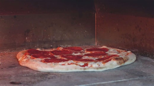 Making homemade sourdough crust for pizza with pepperoni topping