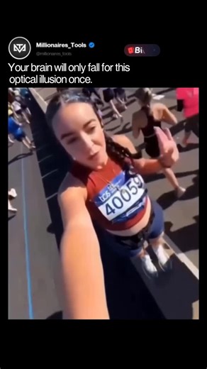 💰 SUCCESS 🚀 MOTIVATION 💎 on Instagram: "In this optical illusion, known as induced motion or vection, a stationary woman on a median appears to glide forward like on a conveyor belt due to marathon runners streaming past her in the opposite direction on both sides. The brain relies on relative motion cues: the background (runners) moving backward tricks it into perceiving the foreground (woman) as advancing. This exploits how our visual system prioritizes contextual movement over absolute sti