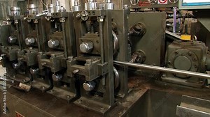 Metal-rolling machines for metalworking of stainless steel profile in tfactory. High-quality rolled metal in industrial production is used for manufacture of parts or an independent element. Stock Video