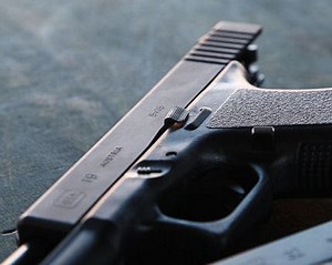 Stock Slide Stop VS. VICKERS TACTICAL Extended Slide stop?