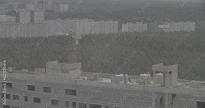 Construction Crane Is Involved In Construction Of A New Multi-storey Residential Houses. Crane At Work. Ungraded, Canon, C-log, C Log, Log. New Multi-storey Residential Buildings. Real Estate Building