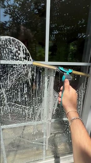Professional window cleaner does a super satisfying window cleaning job!