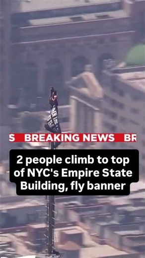 2 people climb to top of NYC's Empire State Building, fly banner