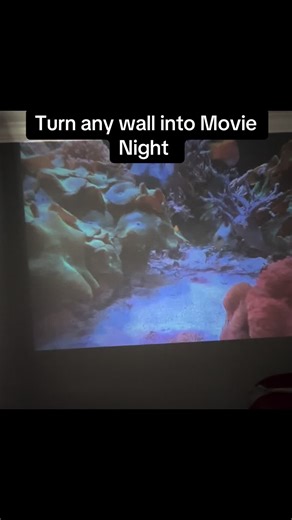 Turn any wall into movie night with this portable projector. Plug in and use the remote. That’s it. Find your favorite channels via WiFi or Bluetooth. Built in audio that you control the volume or mute. Easy peasy. #foryoupage #familytime #movienight #movies #popcorn