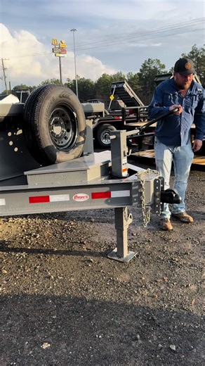 Let's Talk Trailers 🚨 Built for safety and ease. Josh shows how the Demco E-Z Latch coupler makes hooking up to this Delco 14' dump trailer effortless. #FridaysTrailerSales #DoWork #Dealership #Trailers #Business #Delco