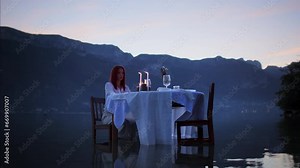 Woman sitting at a table in a lake