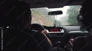 Drive car in rain storm on curve asphalt wet road.