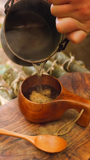 Tender meat cooked on hot rocks over open flames, infused with peppercorns and served with a savory sauce. #OutdoorCooking #GrilledMeat #CampfireCooking #Cooking | Cook Loop