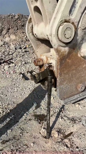 The process of removing bolts with a demolition hammer on a construction site