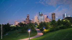 Houston Skyline Night Time Lapse With Mostly Clear Skies from Public Park