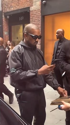 KANYE WEST OUT and about greeting fans and signing autographs