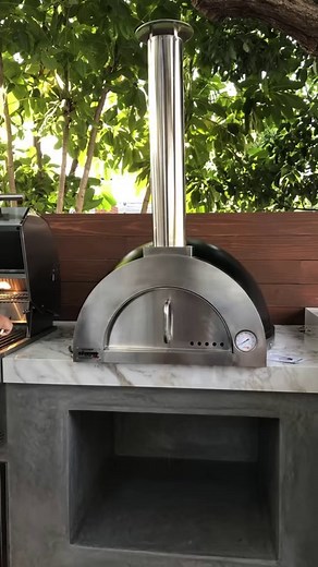  Ready to take your backyard gatherings to the next level? Check out our outdoor kitchen featuring a sleek Outdoor pizza oven! From sizzling pepperoni pies to gourmet creations, this setup has you covered for all your pizza cravings. #OutdoorKitchen #PizzaOven #BackyardGoals ️ | ilFornino Wood Fired Pizza Ovens | Facebook