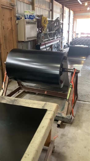 Another black roof with 33’ panels and had to use the trucks to block the wind. #windycity #metalroofing #onthegrind #humpday