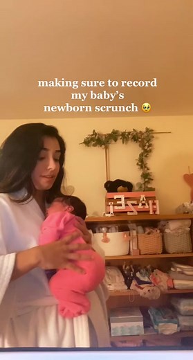 Adorable Newborn Yawning Moment Captured by Loving Mom