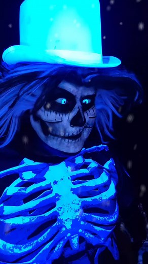 Glowing Skeleton Costume Display in Dark Background