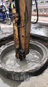 Excavator trying to uncover a manhole | Force Of Nature
