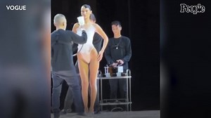 Bella Hadid Gets White Dress Spray-Painted on Her Mid-Show During Paris Fashion Week