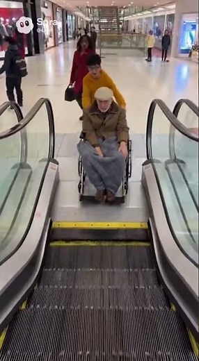 Mall Escalator Wheelchair Accident Prevented by Quick Heroic Jump