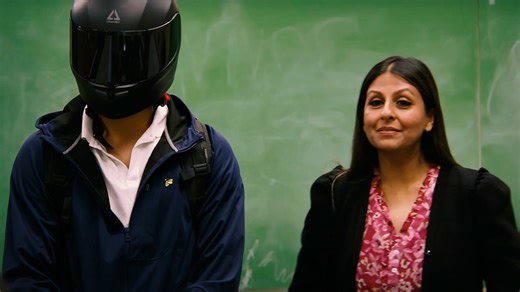 Hiding his face under a mask?