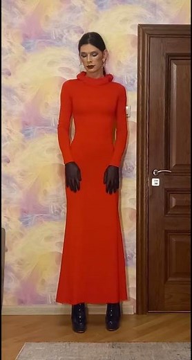 Crossdresser in a long dress posing