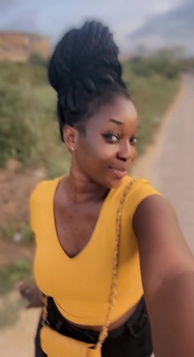Woman in Yellow Top Enjoys a Countryside Walk