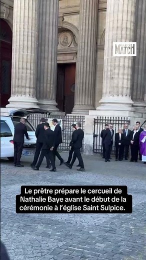 The priest prepares Nathalie Baye's coffin before entering the Saint Sulpice church.