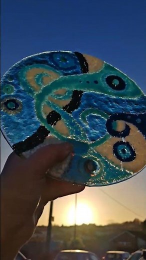 Creating a unique fused glass swirl design using frit (crushed glass) from ‎⁨@BullseyeGlass⁩