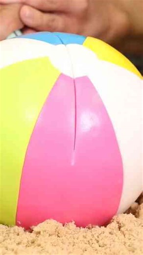 Covering this BEACH BALL CAKE with fondant was challenging