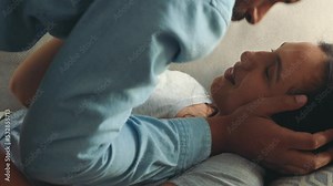 Love, kiss and smile bedroom couple relaxing, romance and bonding in bedroom together at home. Happy man, comfortable woman and smile people in loving relationship, marriage and sexual flirting