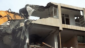 Bulldozer destroying a house - Free Stock Video