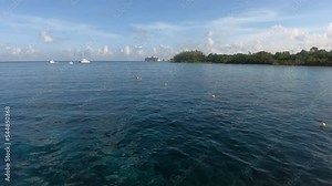 tourist showing ocean POV shot from a boat for snorkeling and swimming | ocean POV shot from fins on in feet of tourist