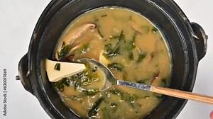 Japanese seaweed miso soup with tofu cheese, slow motion stir