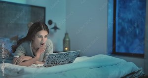 Asian Indian relax woman lying on bed using laptop talking on video chat friends late night. Happy smiling girl look e learning computer webcam screen enjoy fun joy online job work from indoor home