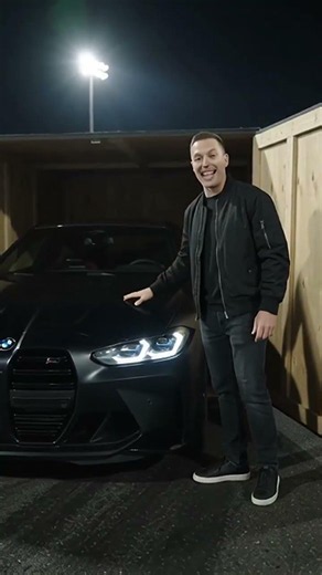 A men unboxing Bmw in night on racing track