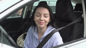 Safety for Women Driving Alone, crime on the road. A woman driver is distracted by someone, she is talking, and at this time a Thief stealing a her bag from the car's side passenger door.