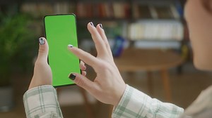 Woman touching a blank phone screen - Free Stock Video