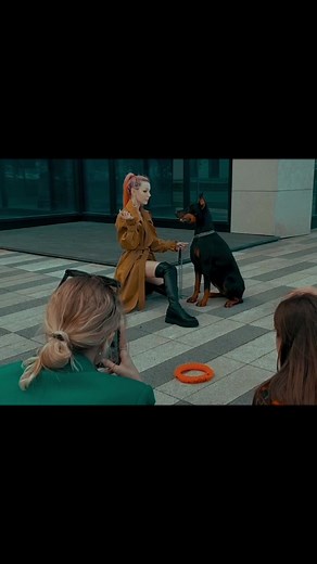 Woman and Doberman Enjoying a City Stroll