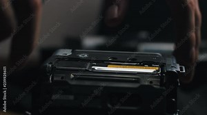 Playing an old mini-dv tape on a camcorder.