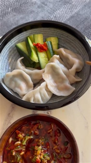 Lunch by 👩‍👦mom - Shrimp 🍤dumpling (shrimp🍤, cilantro, scallion, ginger, soy sauce, sesame oil, and ground pepper) Dumpling salsa - Taiwanese Holy Trinity (lots scallion, ginger, 🧄), crush 🌶🌶🌶, rice vinegar, soy sauce, and sesame oil 🥒🥒- rice vinegar, sesame oil, garlic, sugar, and salt Boil dumplings taught by mom- drop dumplings into boil water and stir gently. When water boil, add a cup of cold water. Repeat the process 3-4 times (frozen dumplings 4x) or just boil for 10-12 minutes 