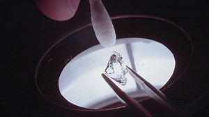 A Gemologist Inspecting a Large Diamond Under a Microscope Stock Video - Video of looking, geologist: 74708115