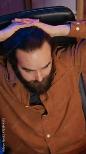 Outraged software engineer perplexed by impossible to remove bugs appearing while coding on computer desktop. Teleworking IT admin feeling baffled by script errors, putting hands on head, camera B