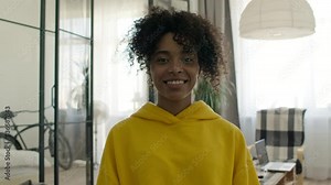 Pretty african american teen school girl looking at camera, adolescent funny mixed race teenage model with afro hair and beautiful face toothy smile posing at home, happy black teenager, portrait