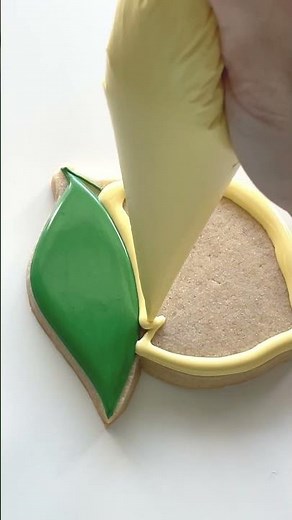 Decorating a Lemon Cookie with Royal Icing!