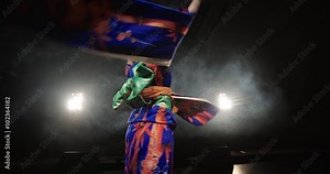 4K beautiful Japanese geisha dancing on stage and posing for the camera,the smoke in the background, slow motion