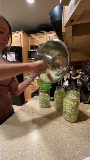 "Canning Sauerkraut: Simple Tangy Goodness 🥬🌶️🥫"