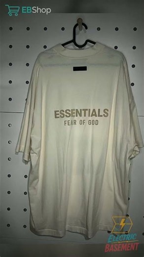 ESSENTIALS by Fear of God Oversized Cream V-Neck T-Shirt — $50 | EBShop