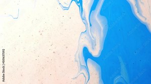 Fluid art drawing video flowing effect. Liquid paint mixing artwork with splash and swirl. Blue ink reacting in water creating abstract background.