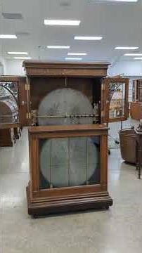 REGINA 12 disc coin op upright music box in quarter sawn oak case 35.5x23x67
