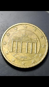 50 Euro Cents 2002 G – Germany 🇩🇪🪙 The 50 Euro cent coin from 2002 with the “G” mint mark was struck at the Karlsruhe Mint in Germany. This coin features the famous Brandenburg Gate on the reverse, one of Germany’s most important national landmarks. The gate symbolizes peace, unity, and freedom, making it a powerful design choice for German Euro coinage. The obverse shows the map of Europe surrounded by the twelve stars of the European Union, representing unity and cooperation among member st